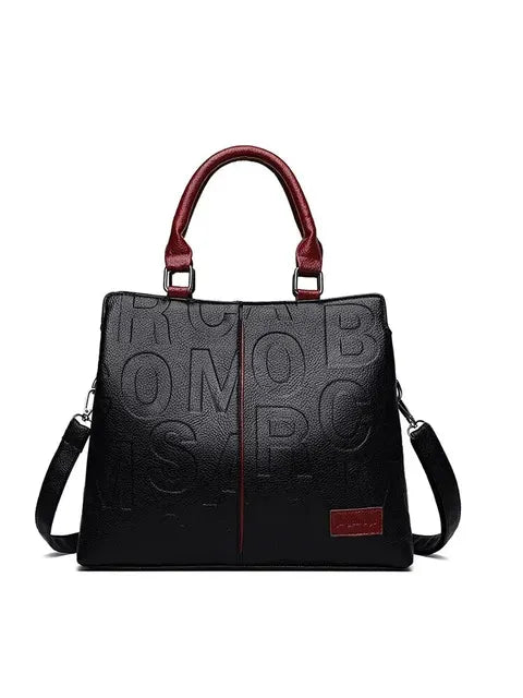 Ladies' handbag in soft leather with embossed letter design