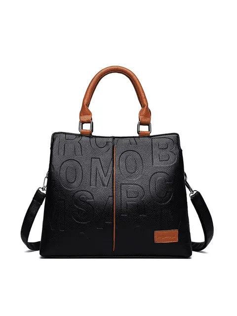 Ladies' handbag in soft leather with embossed letter design