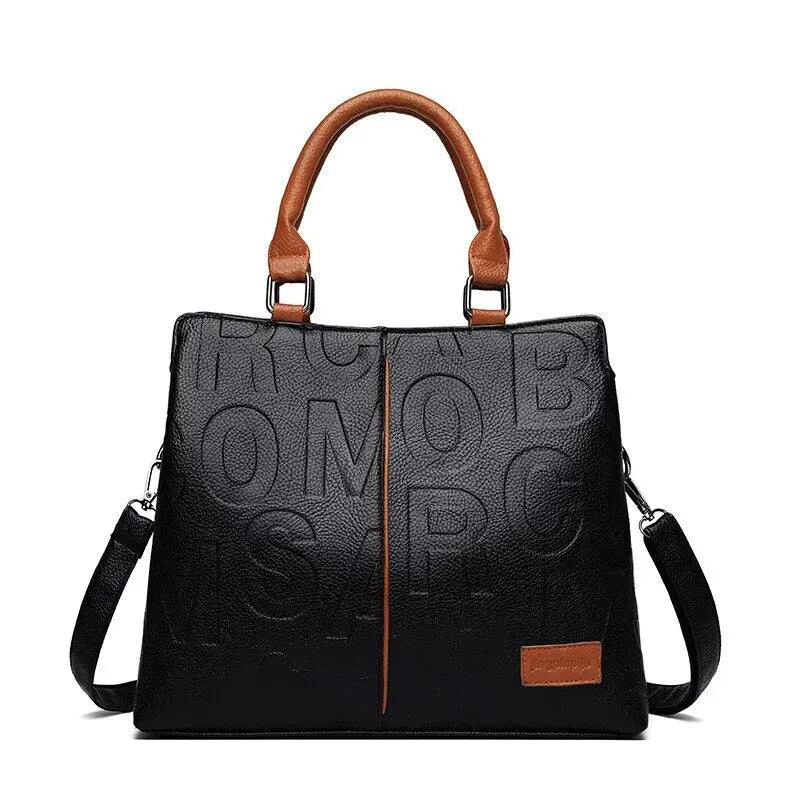 Ladies' handbag in soft leather with embossed letter design