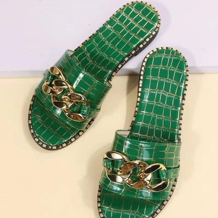 Mules with crocodile pattern