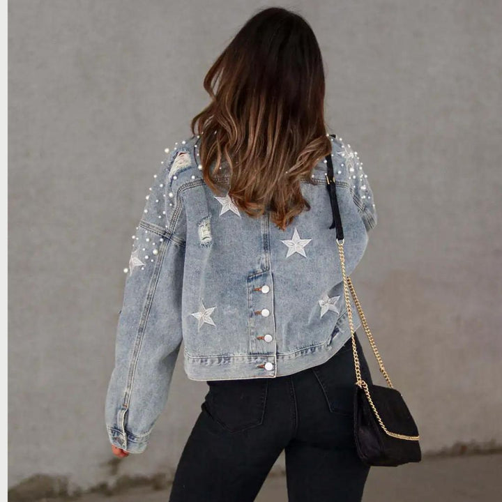 Denim jacket with pearl embellishment and star accents