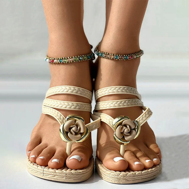 Braided sandals with floral embellishment