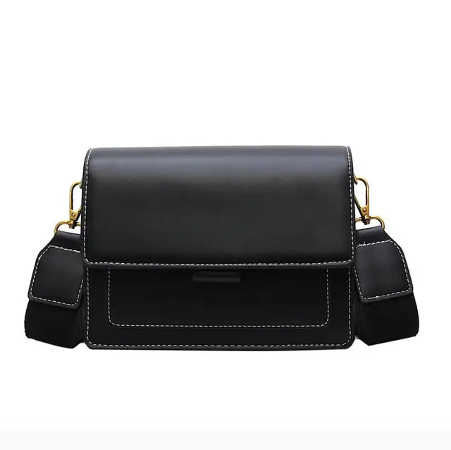 Women's crossbody bag in black leather with soft texture and flap fastening