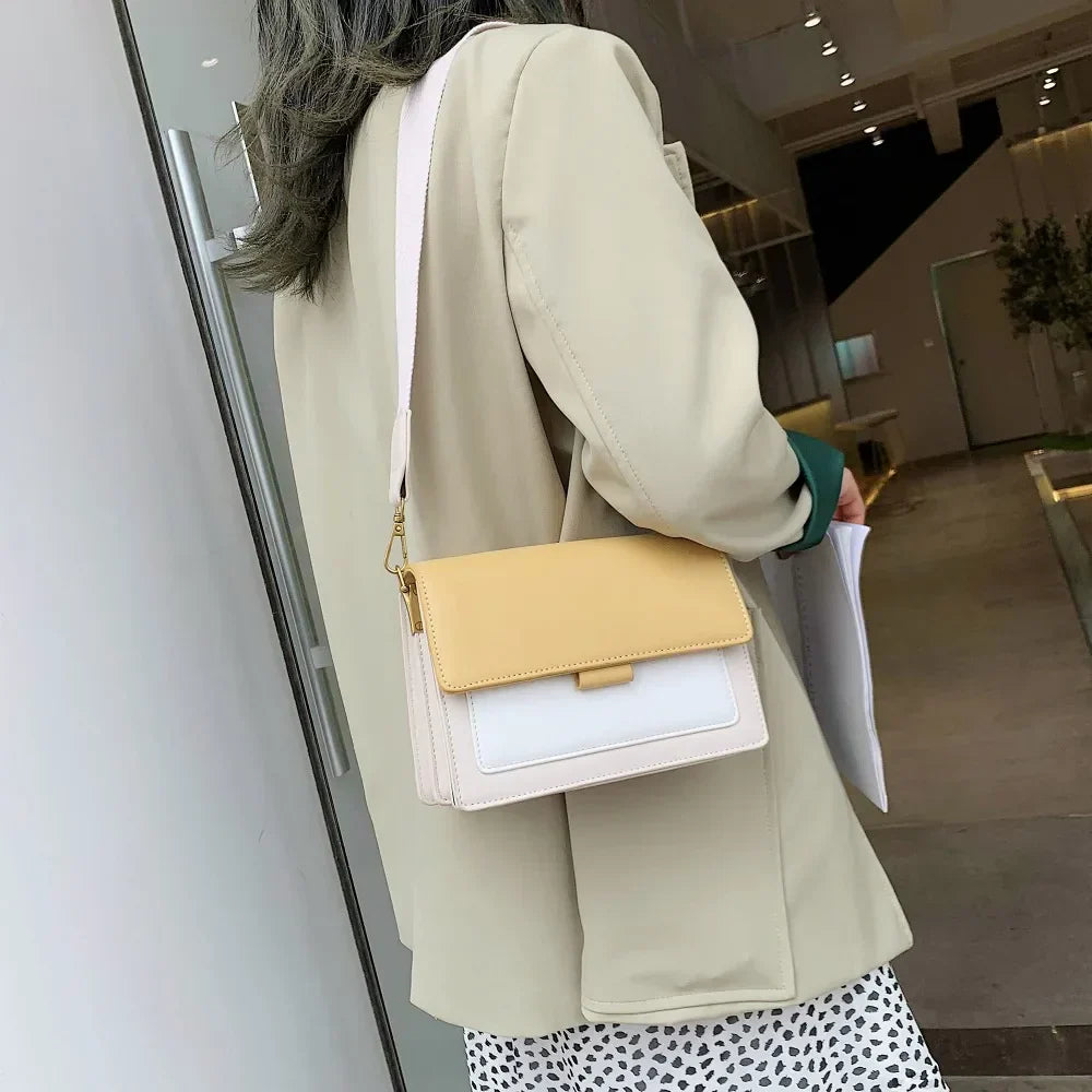 Ladies' crossbody bag in yellow leather with soft texture and flap fastening