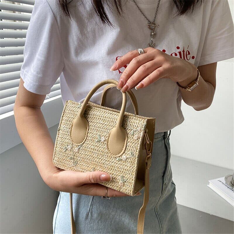 Woven handbag with floral accents