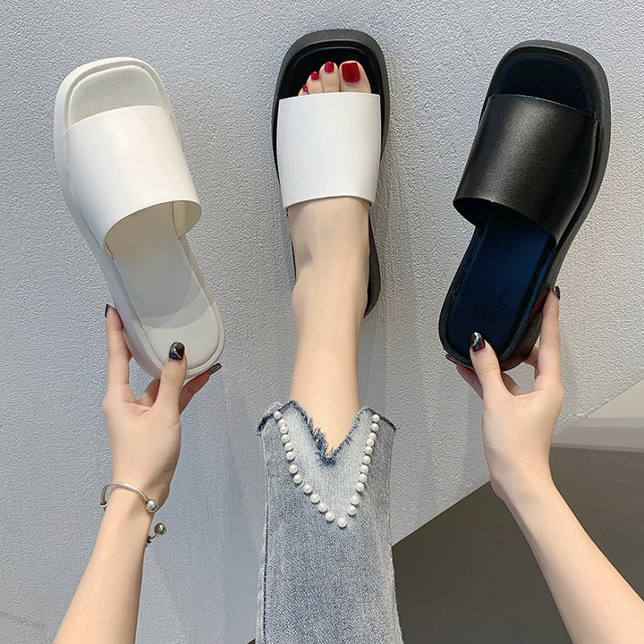 Minimalist slide sandals with wide strap