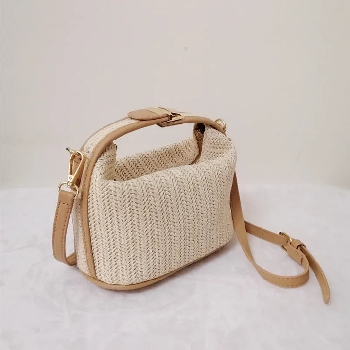 Ladies boho style knitted straw crossbody bag bucket design with zip fastening