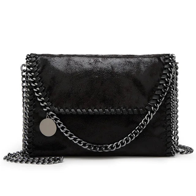 Suede clutch with chain embellishment