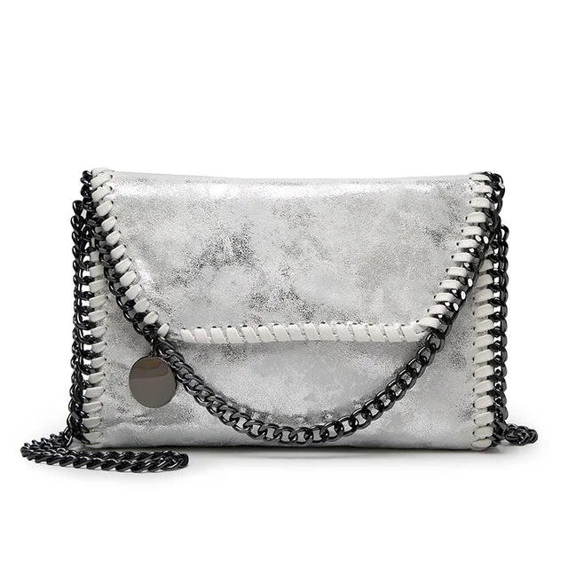 Suede clutch with chain embellishment