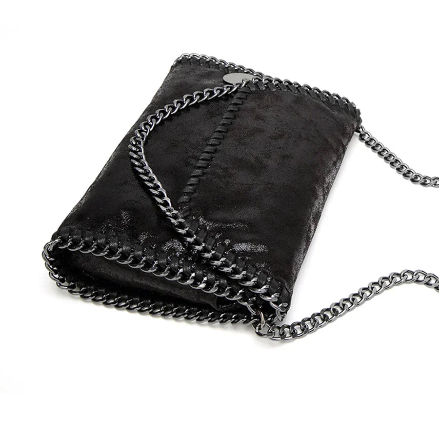 Suede clutch with chain embellishment