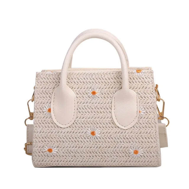 Woven handbag with floral accents